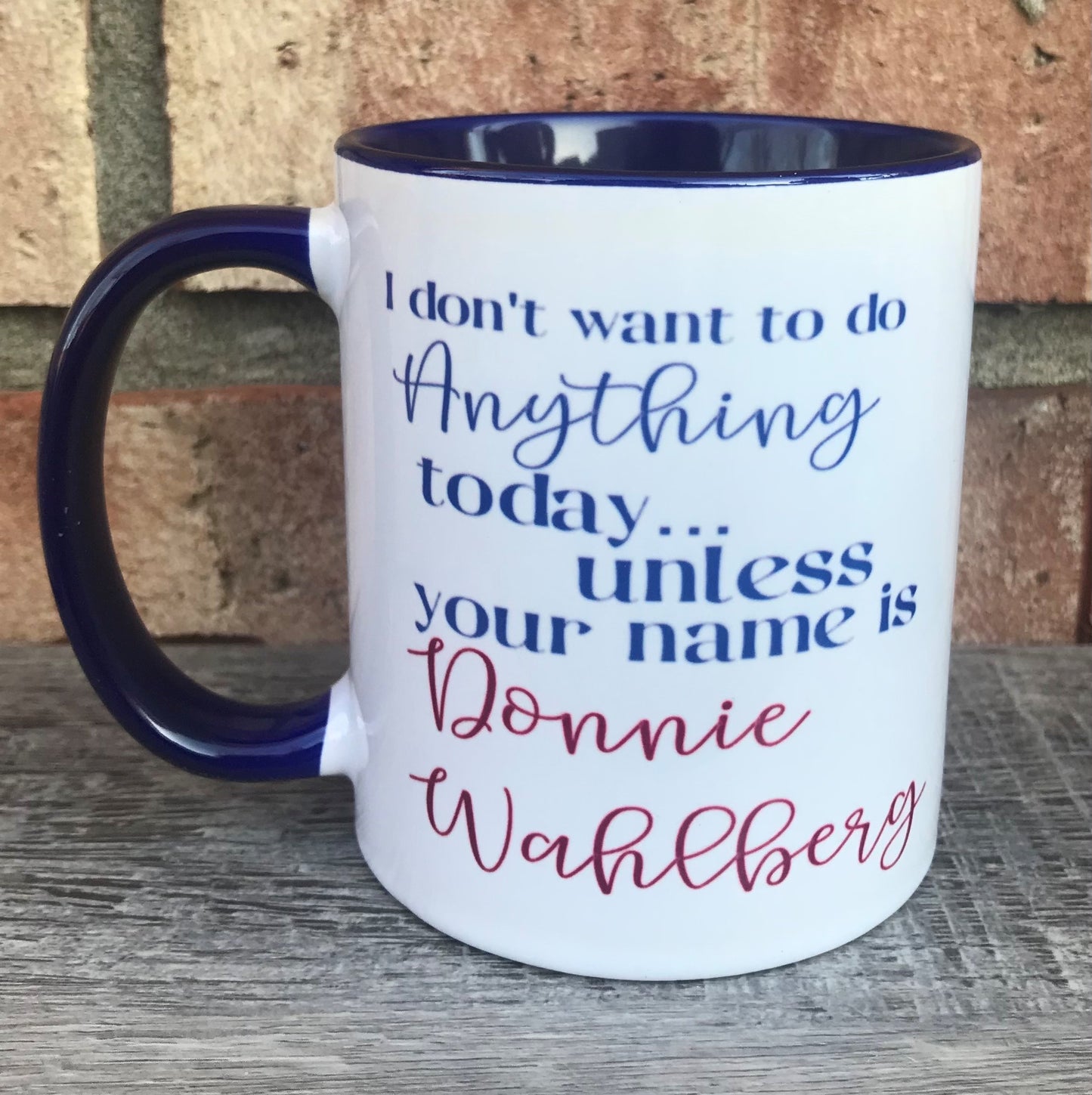 White mug with Blue interior and text reading I don't want to do anything today unless your name is Donnie